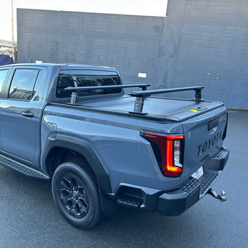 Low Heavy Duty Load Bars and Ruggedized Manual Roller Shutter for Toyota Hilux 2026+ Double Cab